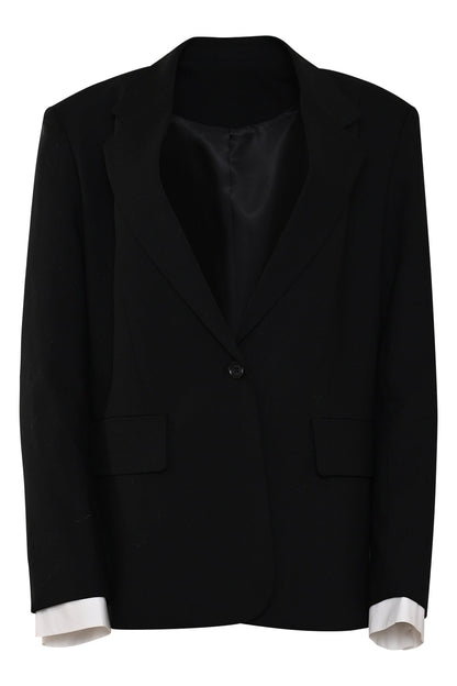 zwarte damesblazer canto met rechte pasvorm, klassieke reverskraag en afneembare contrasterende manchetten.